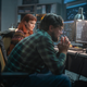 A film still from 'Don't Look Up' with Leonardo DiCaprio and Jennifer Lawrence in front of computers.